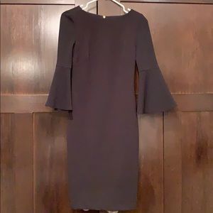 Mid length black dress with bell sleeves